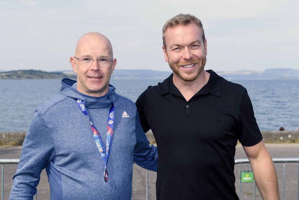 two men standing in front of scenic view